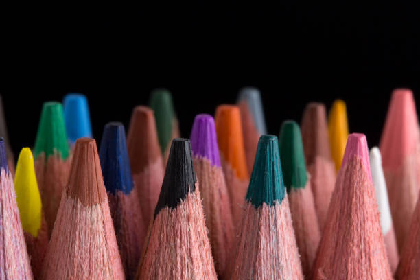 istock color pencils on black background close up. 1048056474