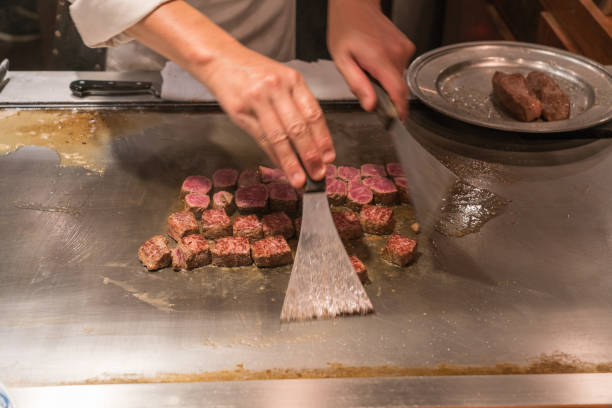 istock Chef hands cooking Japanese Kobe beef 1048059716