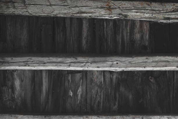 istock Wooden surface of old rural grey barn wall 1048063636