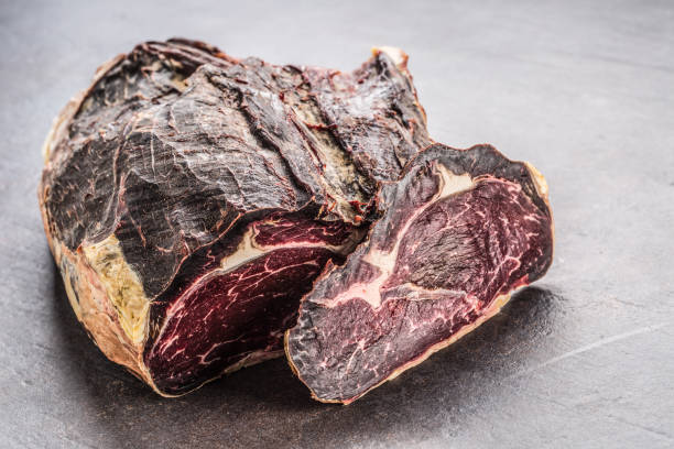 close-up dried beef meat on board in meat shop. - scotch steak imagens e fotografias de stock