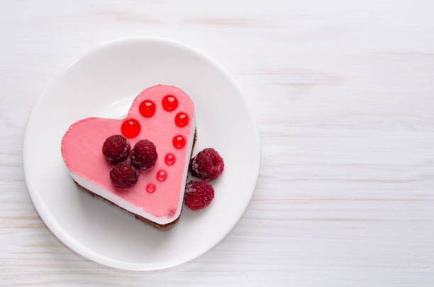 istock nice small cake in the form of heart  on the table 1048064938