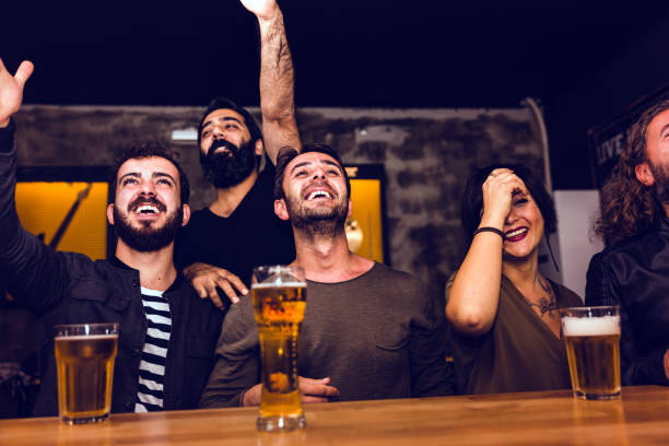 istock Soccer Fans Watching Match Together at Bar 1048070458