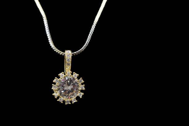 istock Fancy American diamond Chain and Pendant closeup macro image on black background 1048082626