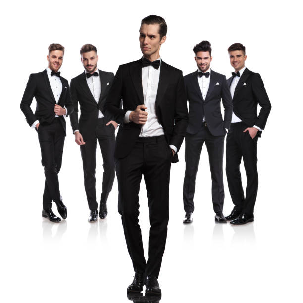 istock team of five relaxed groomsmen standing with leader in front 1048084648