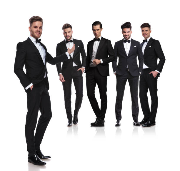 istock handsome man in black tuxedo presents his elegant group 1048085022