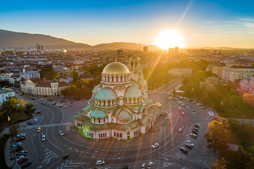 Aerial view of Alexander Nevski cathedral in Sofia, Bulgaria with setting sun. The scene is situated in downtown district of Sofia, Bulgaria (Eastern Europe) during sunset. The picture is taken with DJI Phantom 4 Pro drone.