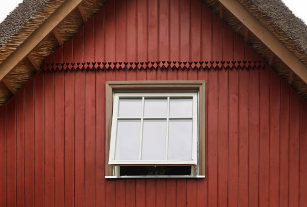 istock Red cottage with new plastic window. 1048087978