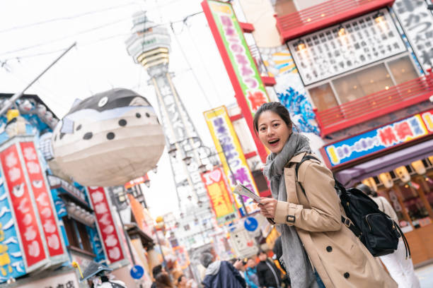 istock beautiful tourist face to camera smiling 1048089662