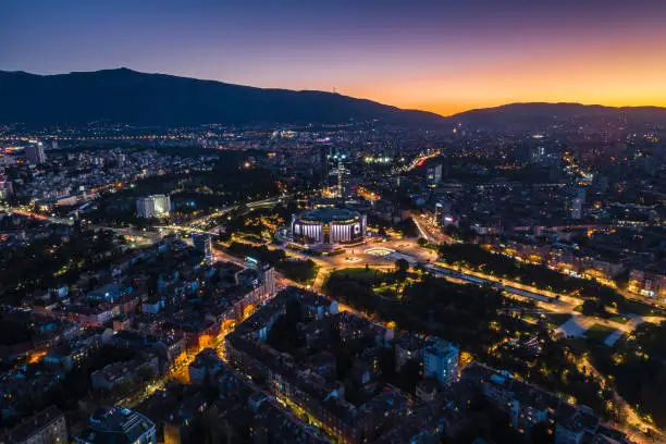 Ultra wide night aerial view of downtown district in Sofia, Bulgaria. The scene is situated in downtown district of Sofia, Bulgaria (Eastern Europe) during sunset / dusk / night. The picture is taken with DJI Phantom 4 Pro drone.