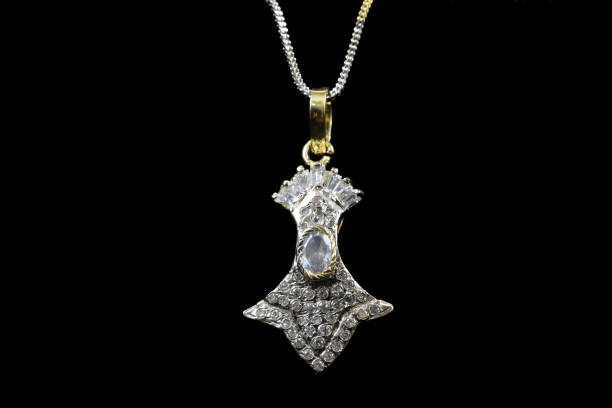 istock Fancy American diamond Chain and Pendant closeup macro image on black background 1048094144