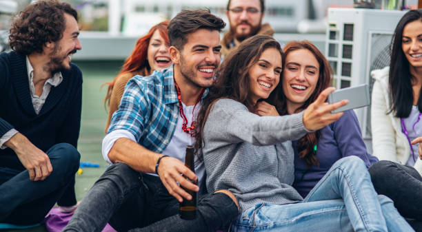 istock Three Friends taking selfie on the rooftop 1048098842