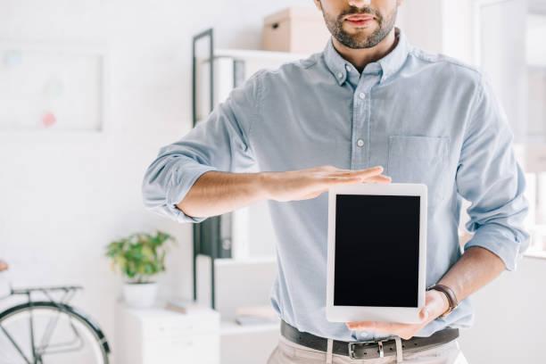 istock cropped image of architect showing tablet with blank screen in office 1048099714