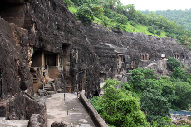 The view of Ajanta caves, the rock-cut Buddhist monuments. The view of Ajanta caves, the rock-cut Buddhist monuments. It's literally a mountain that carved into magnificent statues, monasteries and temples. It's listed as one (of many) of UNESCO World Heritage sites. Taken in India, August 2018. aurangabad maharashtra photos stock pictures, royalty-free photos & images