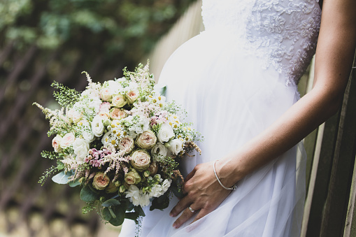 Unrecognizable woman holding a bridal bouquet
