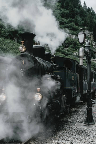 istock Old-fashioned steam train in Swiss Alps 1048105688