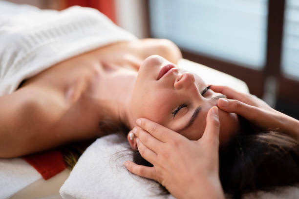 istock Woman enjoying a head massage 1048108228
