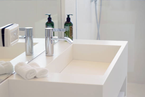 istock Modern white bathroom sink with faucet 1048108610