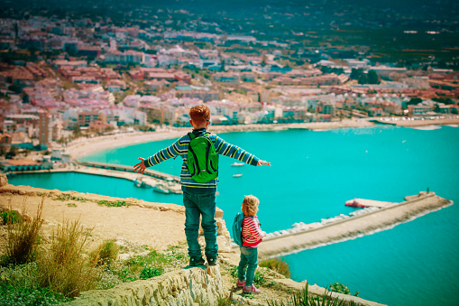 little boy and girl enjoy travel, looking at view, family vacation