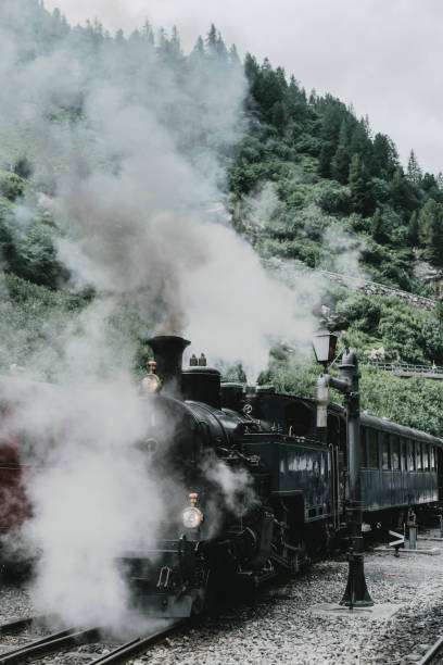 istock Old-fashioned steam train in Swiss Alps 1048113572