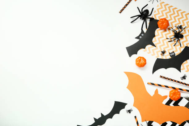 istock Halloween paper decorations with pumpkins and spiders on white background 1048113758