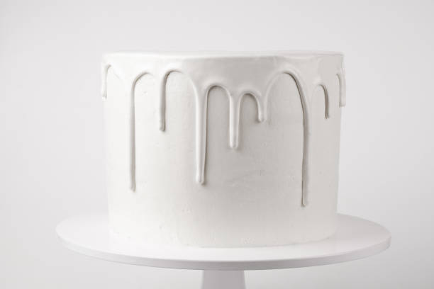 istock White cake with glaze on a white background. 1048120092