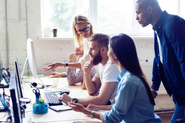 istock Creative office. Young modern colleagues in smart casual wear working while spending time in the office. 1048124266