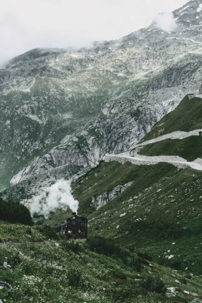 Old-fashioned steam train in Swiss Alps  in summer