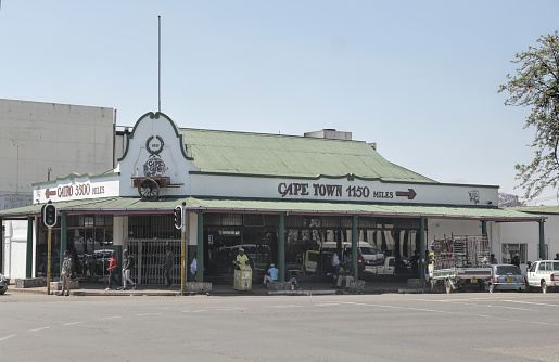 Bulawayo, Zimbabwe, 14 September 2018. This is the Cape to Cairo restaurant in Bulawayo, built in 1931. The exterior is characterised by two direction signs: Cairo 3500 miles, and Cape Town 1150 miles.