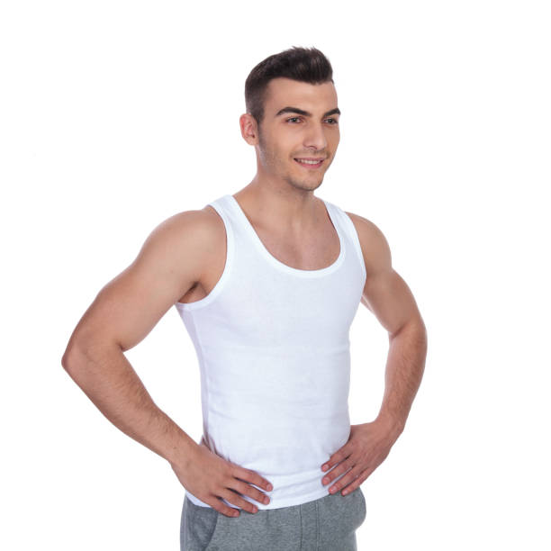 istock lean and confident man holding hips looks to side 1048131000