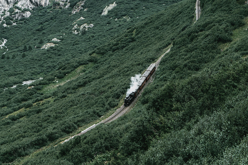 Old-fashioned steam train in Swiss Alps  in summer