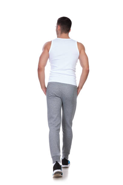 istock rear view of relaxed man walking and looking to side 1048131670