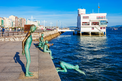 SANTANDER, SPAIN - SEPTEMBER 26, 2017:  Los Raqueros Monument jumping boys at Santander embankment promenade in Santander city, Cantabria region, Spain