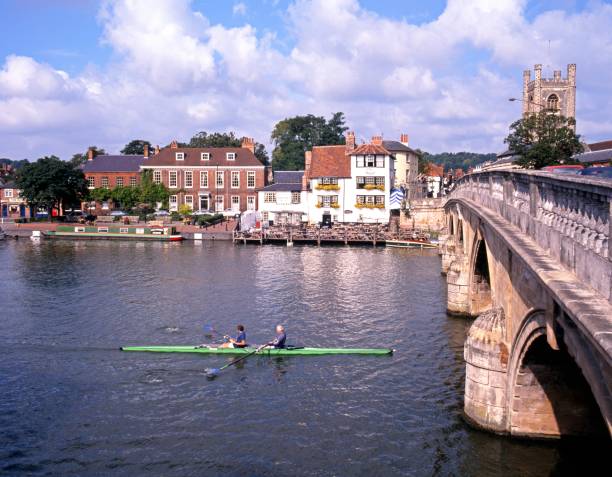 Rowing boat on the River Thames with views towards the Angel Pub, Henley-on-Thames, Oxfordshire, England, UK, Western Europe.
