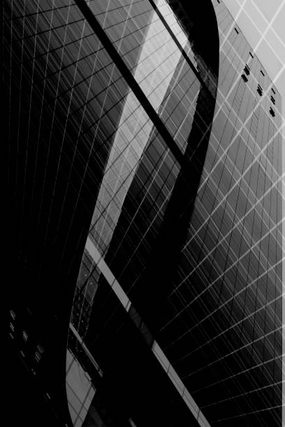 istock Computer graphic image in grunge technique resembling skyscraper fragment. Abstract black and white modern architecture background with curvilinear central element. 1048148396