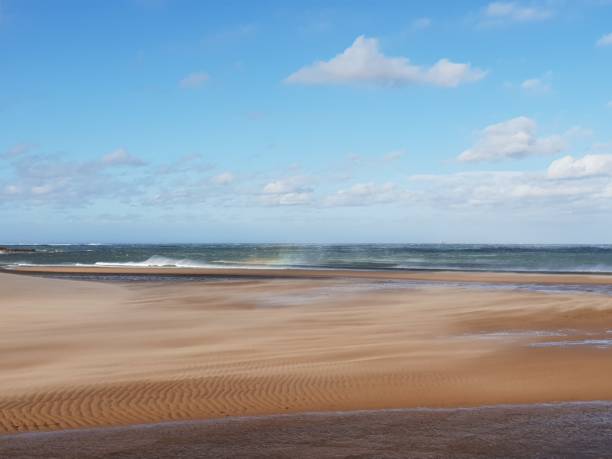 istock Clouds over sea and coastline 1048154422