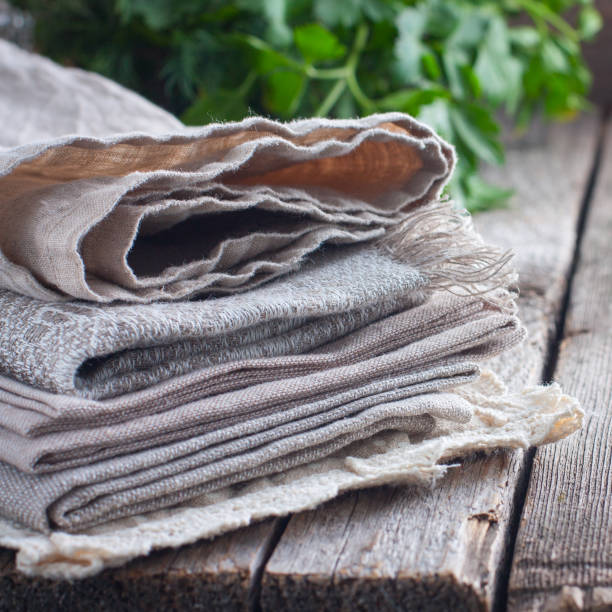 istock Clean linen towels on the kitchen table, selective focus 1048155572