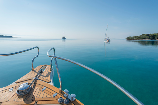 Yacht and sailing boats moored on Adriatic Sea, Susak, Croatia.