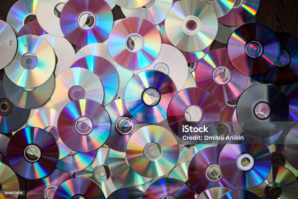DVD and CD background DVD and CD background. Old information disks DVD Stock Photo