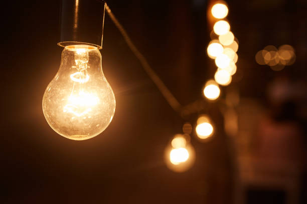 istock Burning light. Light bulb close-up. Garland. In the dark. 1048173272