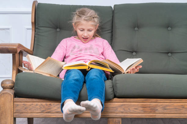 istock Girl with open books 1048183226
