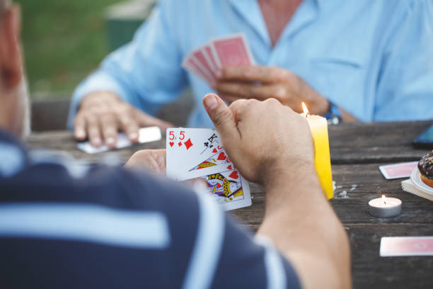 istock Senior people playing cards game 1048183542