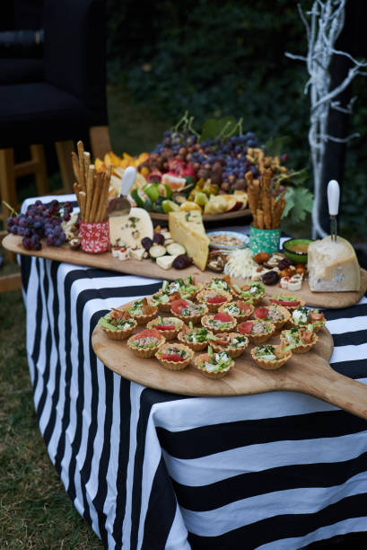istock Holiday party outdoors picnic with food table 1048183770