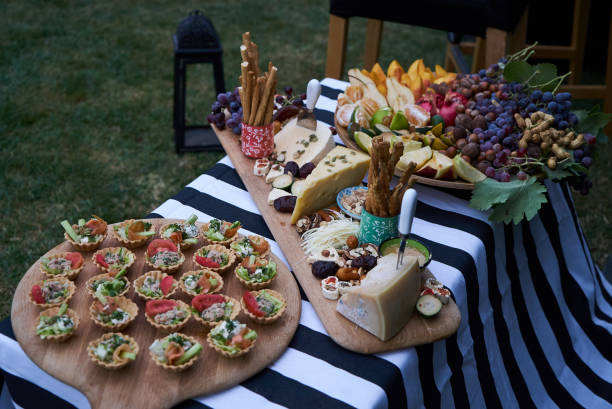 istock Holiday party outdoors picnic with food table 1048183776