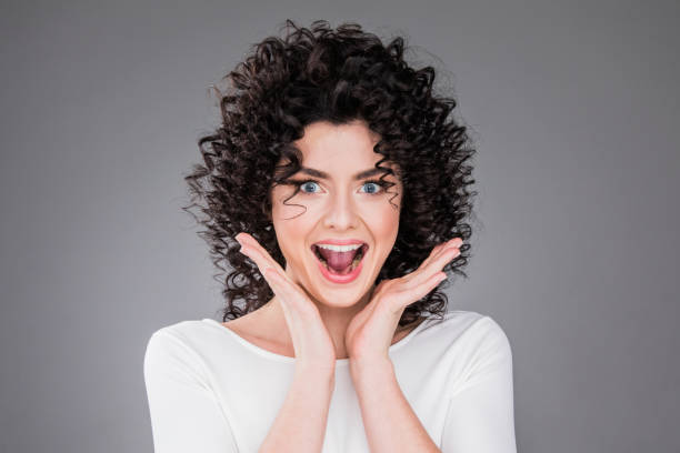 istock Woman screaming amazed in joy 1048184130