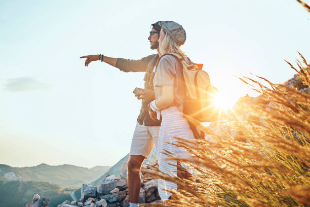 istock young couple having a nice day hiking together 1048187848