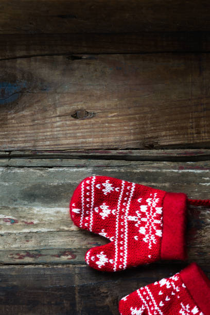 istock Christmas Red Knitted Mittens with Snowflake Motives 1048188068