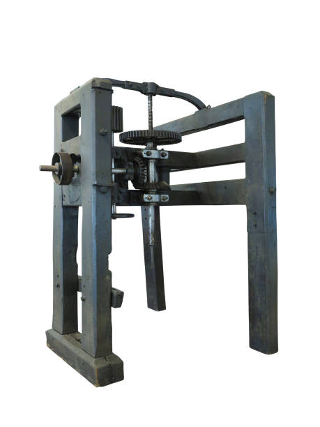 istock Vintage old wooden drilling machine isolated over white 1048190614