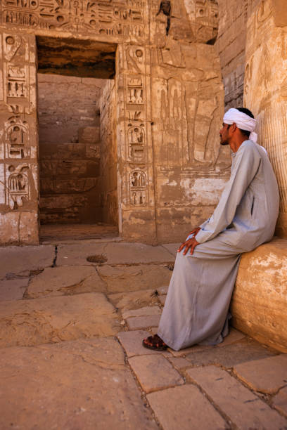 istock Egyptian man resting in ancient temple, Egypt 1048191076