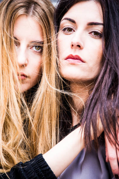 istock Nice young hipster models are hugging and posing on the street. 1048193950