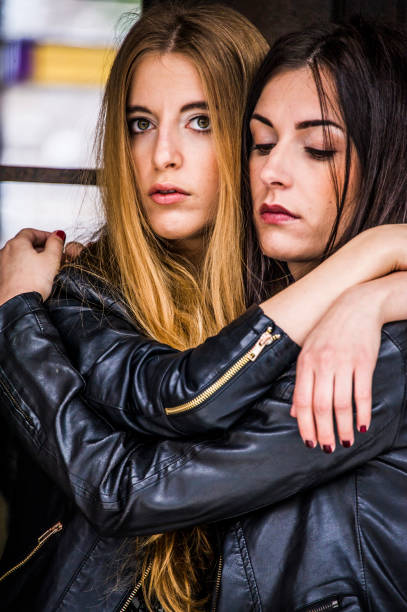 istock Nice young hipster models are hugging and posing on the street. 1048194226